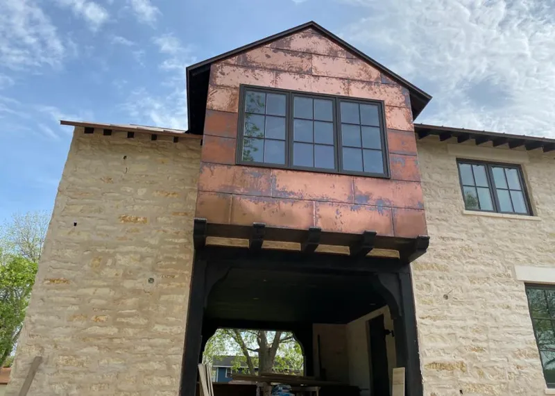 Copper metal panel facade on a stone building for Skylight Installation in Eastvale